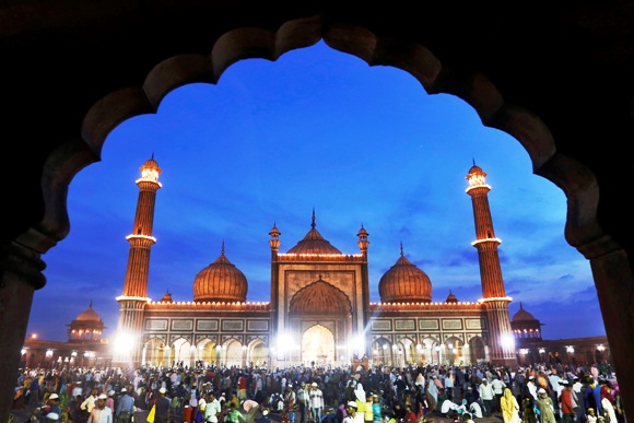 Muslims gather after having their iftar (breaking fast) meal during the holy month of Ramadan at the Jama Masjid (Grand Mosque) in the old quarters of Delhi.
