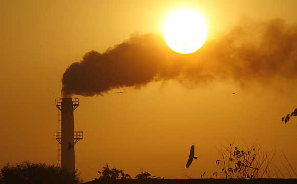 Smoke rises from a chimney of a garbage processing plant on the outskirts of Chandigarh.