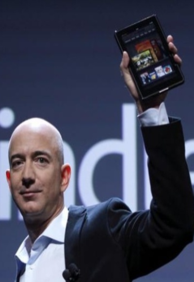 Amazon CEO Jeff Bezos holds up the Kindle Fire in New York.