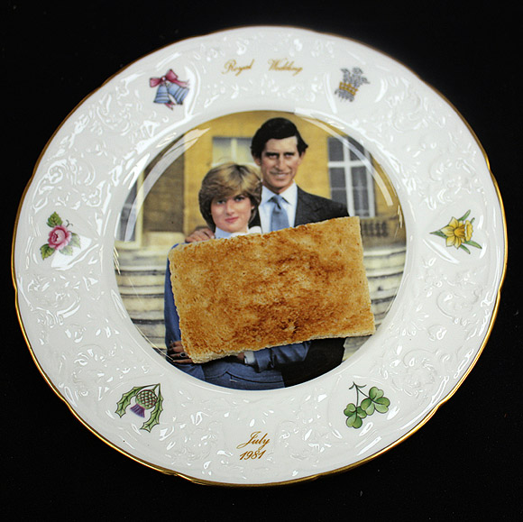A slice of toast is seen on a plate commemorating the Royal Wedding of Britain's Prince Charles and Princess Diana, before its auction in Etwall, Derbyshire.