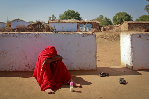 Krishna, 14, breaks down after her husband Kishan Gopal, 16, came home drunk in a village near Baran, located in Rajasthan.