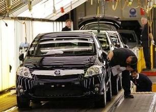 Image: Cars are inspected at the end of the production line at the Toyota factory. Photographs: Darren Staples/Reuters