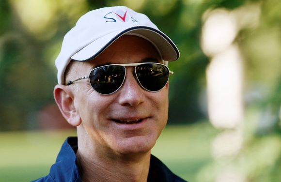 Amazon CEO Jeff Bezos (R) arrives at the annual Allen and Co. conference at the Sun Valley, Idaho Resort.