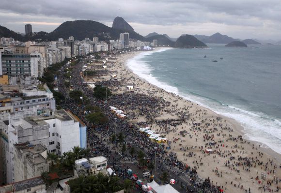 An aerial view of people flocking to see Pope Francis as he arrives at Copacabana Beach in Rio de Janeiro.