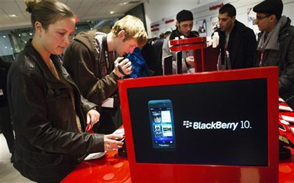People view the new Blackberry Z10 device at a Rogers store in Toronto.