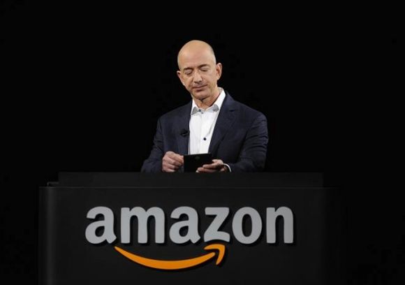 Amazon CEO Jeff Bezos demonstrates the Kindle Paperwhite during Amazon's Kindle Fire event.