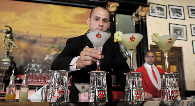 A bartender prepares a display of frozen daiquiris, a product of Pernod Ricard, at The Floridita bar in Havana, Cuba.