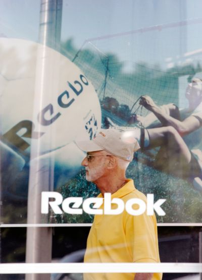 A customer enters the Reebok outlet store in Stoughton, Massachusetts.