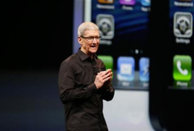 Apple Inc. CEO Tim Cook takes the stage after the introduction of the iPhone 5 during Apple Inc.'s iPhone media event in San Francisco.