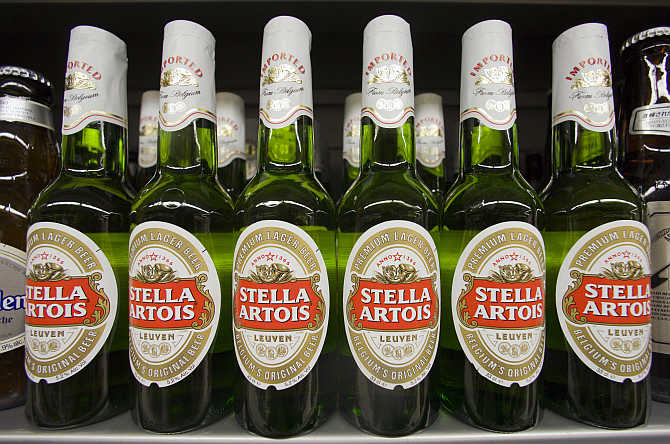 Bottles of Stella Artois beer are displayed at a store in Hong Kong's Sheung Wan district.