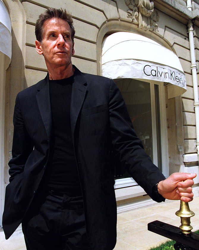 US designer Calvin Klein poses in front of his boutique on Avenue Montaigne in Paris, France.