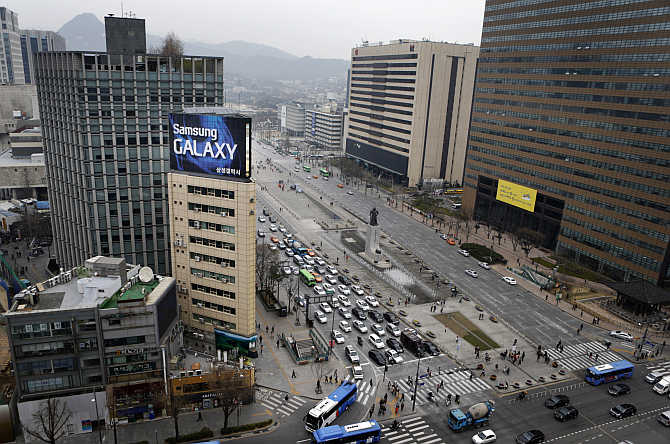 Samsung outdoor advertisement sits atop an office building in Seoul, South Korea.
