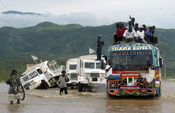 A UN truck overturns while a convoy makes its way to Gonaives after floodwaters covered Haiti's national highway.