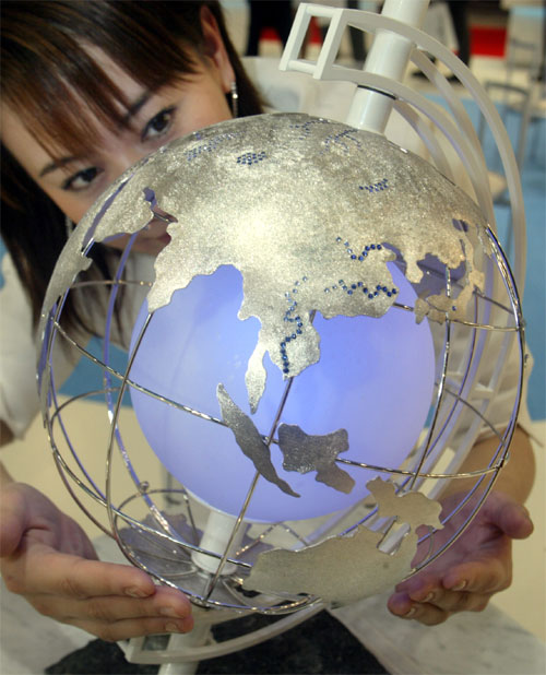 A globe made of 1600 grams of platinum is displayed at a jewelry exhibition in Tokyo.