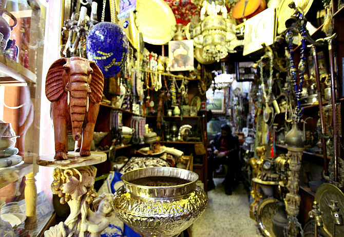 A shopkeeper works inside his shop in the old market of Tripoli, Libya.