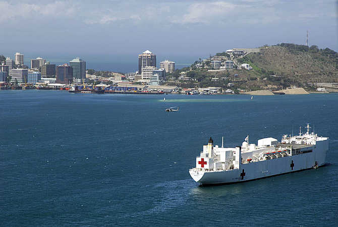 The United States's Military Sealift Command hospital ship USNS Mercy (T-AH 19) anchored off the coast of Papua New Guinea in Port Moresby.