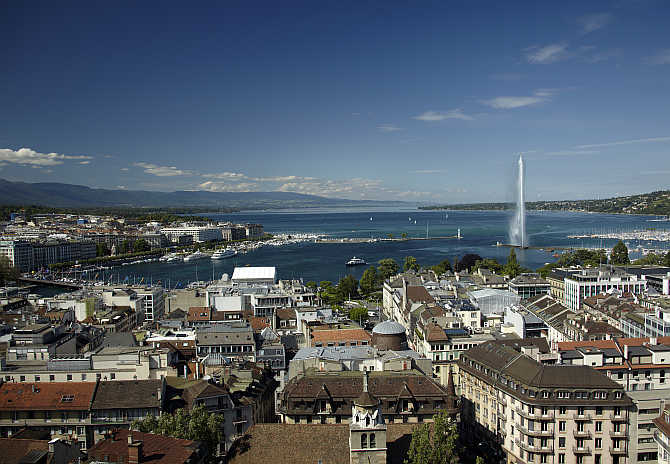 An overview picture shows the Jet d'Eau and the Lake Leman from the St-Pierre Cathedrale in Geneva.