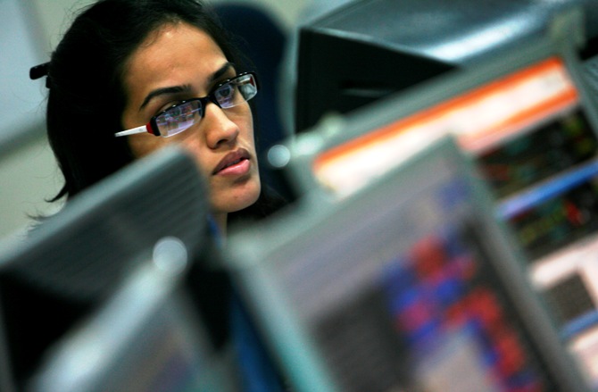 A broker looks at a computer screen at a stock brokerage firm in Mumbai.