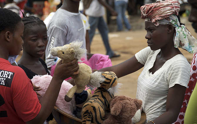 A woman sells toys at a market in the Liberian capital Monrovia.