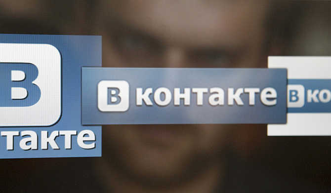 A man looks at a computer screen showing logos of Russian social network VKontakte in Moscow.