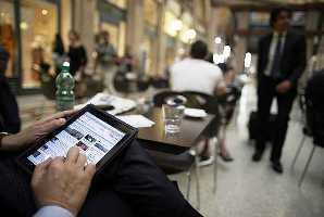 A man works on a tablet.