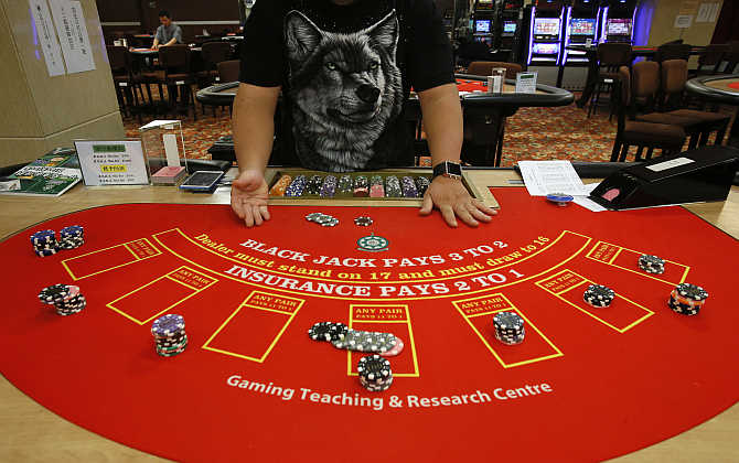 A student practices at a mock casino run by the Macao Polytechnic Institute in Macau.