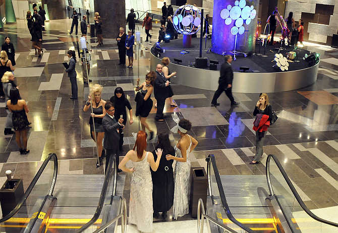 Guests mingle during a preview party at the grand opening of MGM Mirage's $8.5 billion CityCenter project centerpiece, Aria Resort & Casino, in Las Vegas, Nevada.