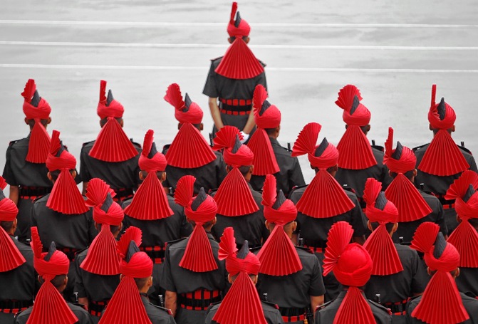 Indian army recruits stand at attention as they take part in a passing out parade at a garrison in Rangreth on the outskirts of Srinagar.