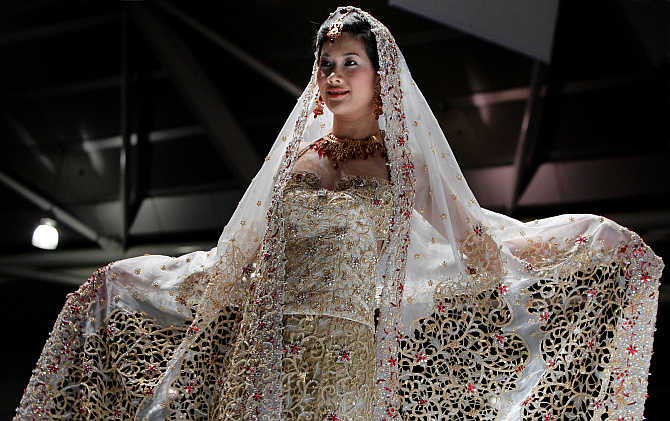 A model presents a creation by Indian designer Devki Karer for label DEVKI's at a fashion show in Singapore.