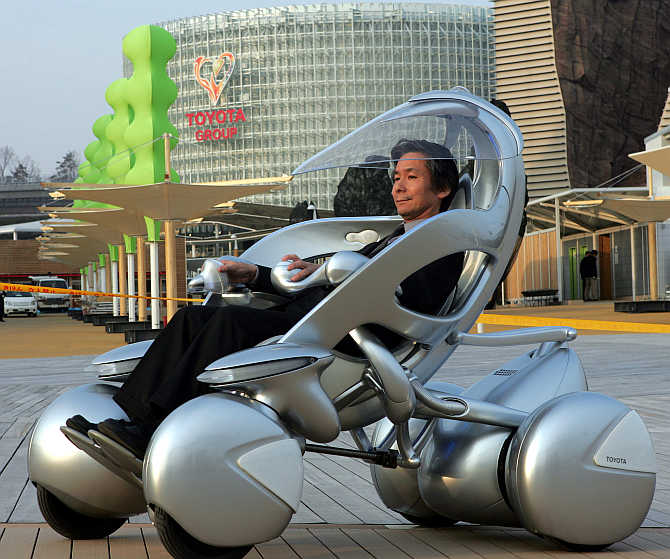 A man rides Toyota Motor's one-seater 'i-unit' vehicle in Nagoya, Japan.