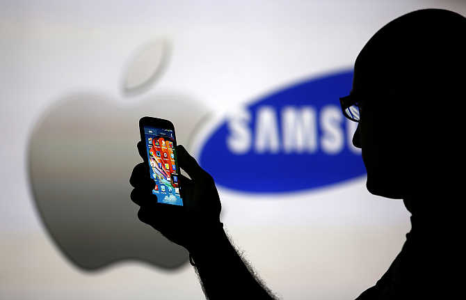 A man poses with a Samsung Galaxy S4 in Zenica, Bosnia.