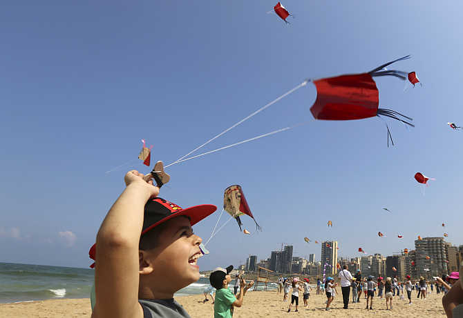 Children fly their kites during an Interschool Kite Meetings in Beirut, Lebanon.