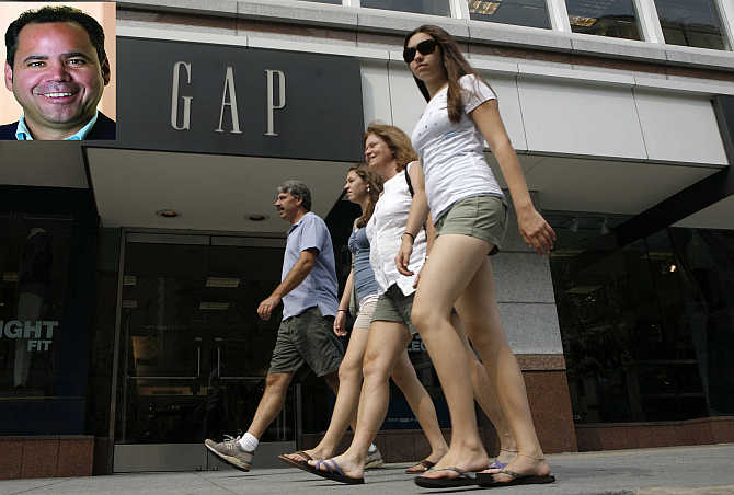 Pedestrians pass by a Gap clothing store in Washington. Inset, Glenn Murphy.