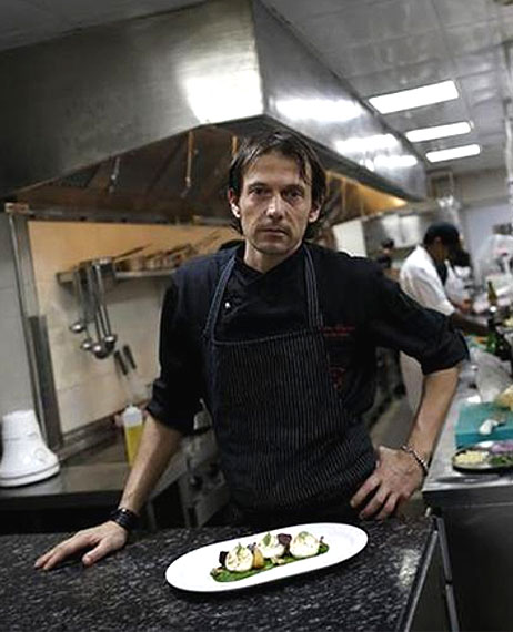 Matteo Boglione, executive chef of Le Cirque Signature restaurant, poses for a picture inside the kitchen in Mumbai 