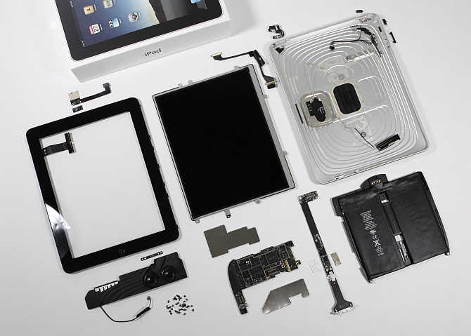 Components of an iPad are laid out during a teardown by iFixit's Luke Soules in Glen Ellen, Virginia. Apple's iPad includes chips from Samsung Electronics Broadcom and Texas Instruments.