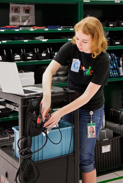 Rachel Mitchell preps a cart to repair the servers that store Google's corner of the Internet.