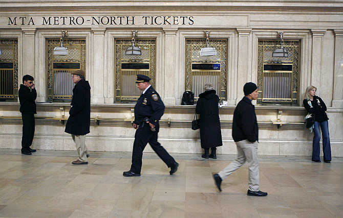 Commuters wait and walk through Grand Central Station in New York, United States.