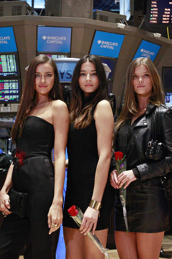 Sports Illustrated Swimsuit models on the floor of a stock exchange in New York.