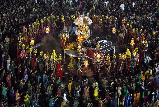 Devotees perform Garba during the celebrations to mark the Navratri festival in Surat.