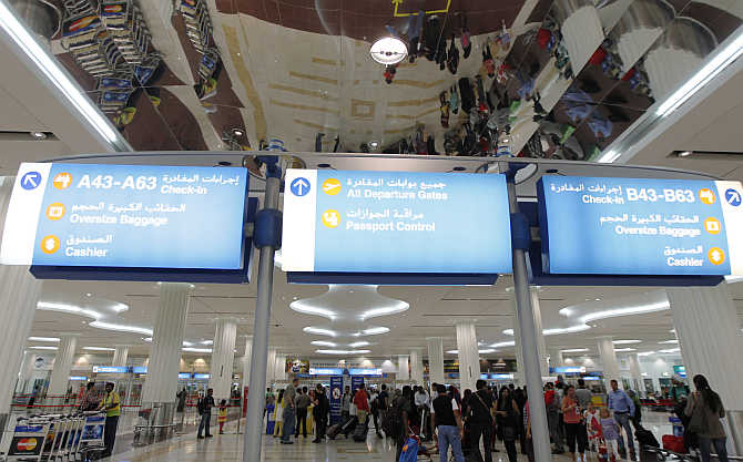 Travellers at the Emirates terminal at Dubai International Airport.