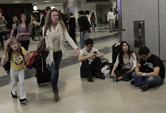Travellers at the Delta Airlines arrival area at Los Angeles International Airport in Los Angeles, California.