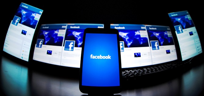  The loading screen of the Facebook application on a mobile phone is seen in this photo illustration taken in Lavigny.