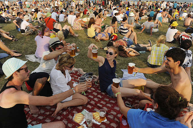 Revellers drink beer during the Pohoda music festival at Trencin airport, 130km north of Bratislava, Slovakia.