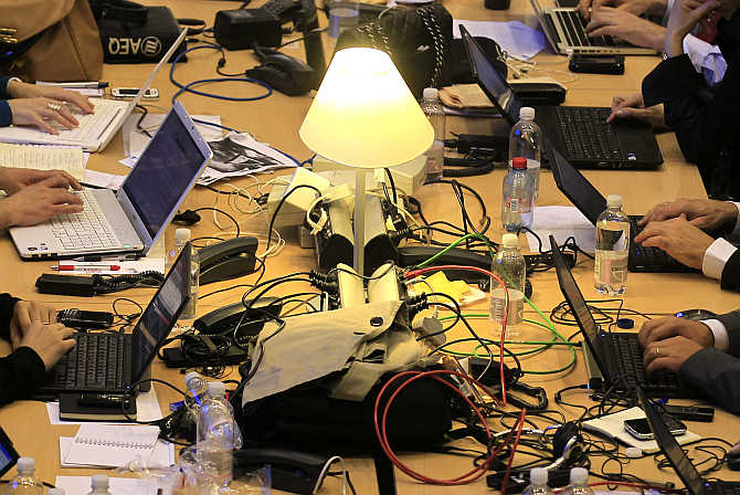 Journalists work in the main media hall at the European Union summit in Brussels, Belgium.