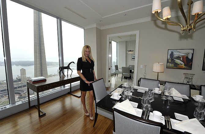 Sales Manager Jacqueline Yaffe in the dining room of a model suite in a hotel in Toronto. Photo is for representation purpose only.
