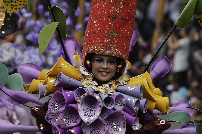 A woman dressed in flower costumes participate in the11th Jember Fashion Carnival in Jember, Indonesia's East Java province. The community also flourished in Java.