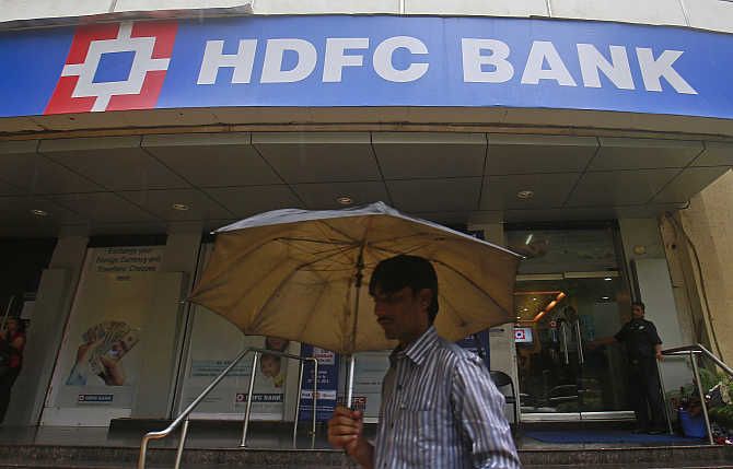 A customer walks outside an HDFC Bank branch in Mumbai.