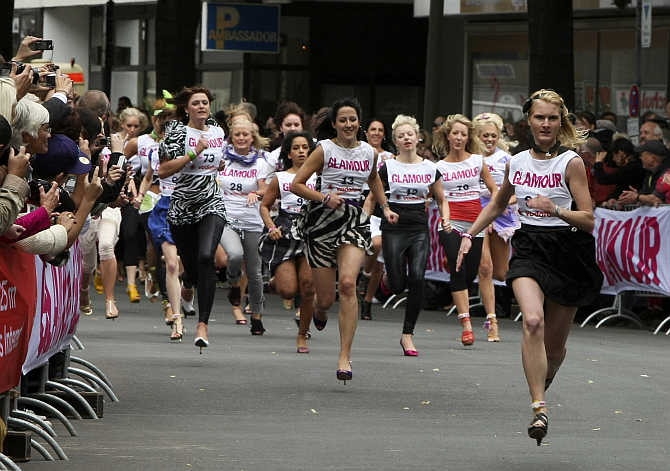 Women compete in a 100-metre stiletto sprint competition in Berlin, Germany.