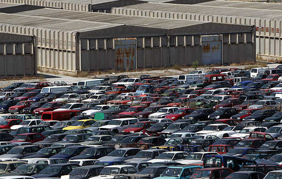 Confiscated cars inside a warehouse of Oddy in Athens.