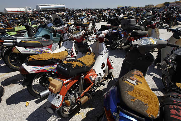 Damaged and confiscated motorcycles in a yard of Oddy in Athens.